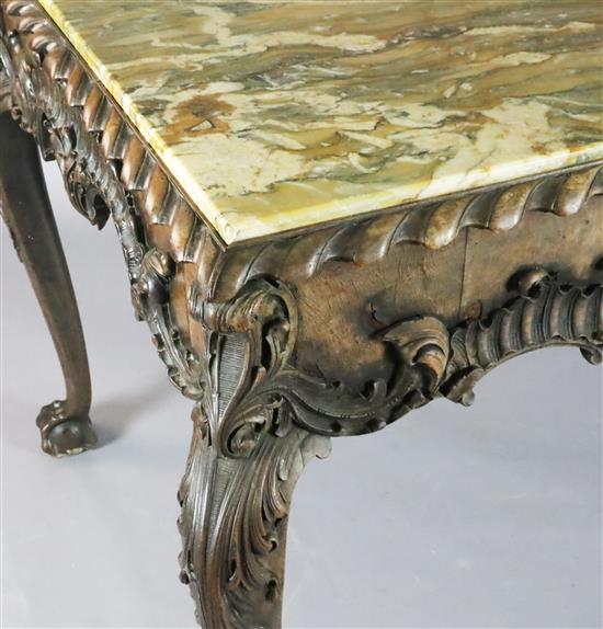An impressive George II walnut and marble topped centre table, c.1740-50, W.5ft 4in. D.3ft 1.5in. H.2ft 10in.
